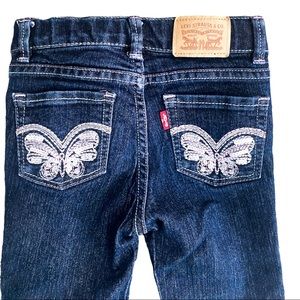2T Levi’s 710 skinny blue jeans with butterflies 🦋 on back pockets.